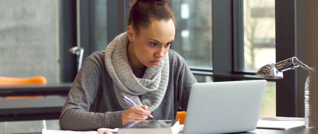 a woman studying and researching online information